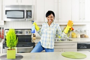 Girl-Cleaning-Kitchen-Happily