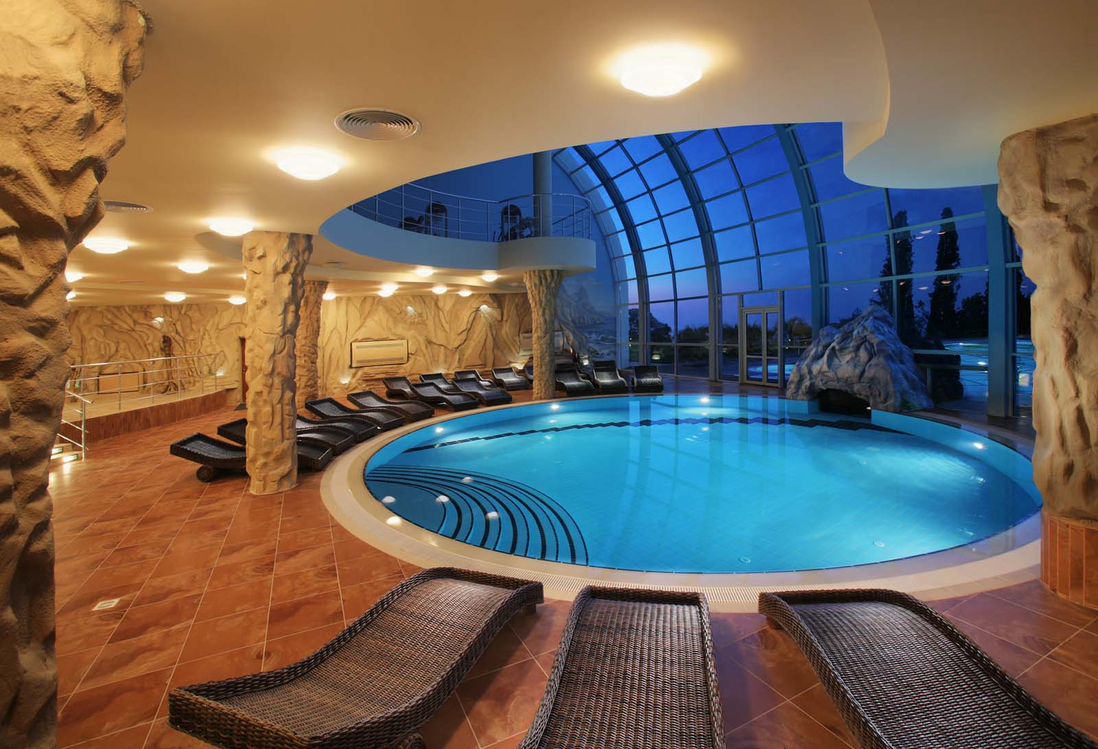 admirable indoor living space decoration with round indoor swimming pool and japanese benches