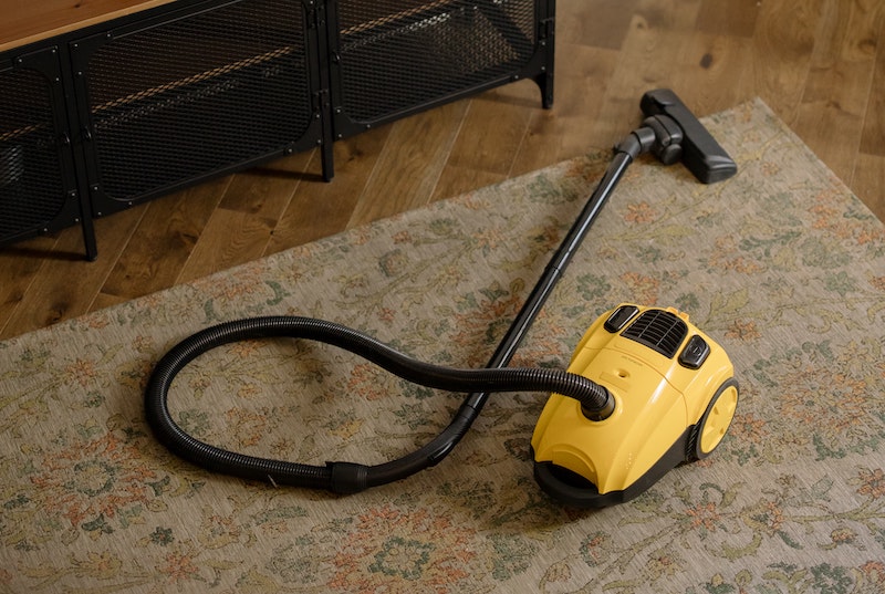 How do you properly vacuum the floor?